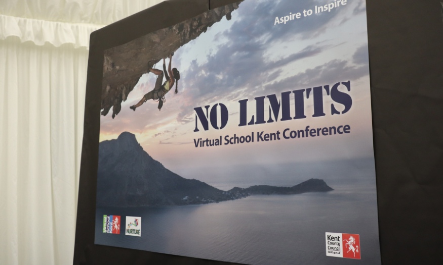 Big banner with No Limits writing and a person climbing a mountain